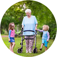 Grandma in park with her grandchildren